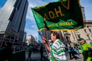 Images from downtown Indy's St. Patrick's day parade - A flag bearer