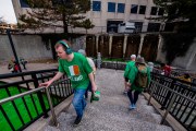 Images from downtown Indy's St. Patrick's day parade - people on stairs