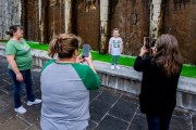 Images from downtown Indy's St. Patrick's day parade - kid on ledge of canal