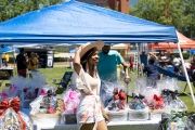 woman smiling at tent Indy Juneteenth Celebration