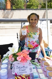 woman smiling holding product