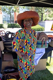 Indy Junteenth Celebration woman smiling under tent