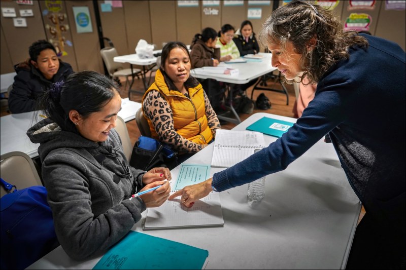 Chin Refugees of Indianapolis
Language instructor Lori Eades (right) drills Burmese Chin refugees in English at the Indiana-Chin Center in the Indianapolis neighborhood of Southport.