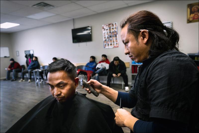 Chin Refugees of Indianapolis
A Chin-run barbershop along Madison Street in suburban Indianapolis caters to the thousands of Burmese refugees in the Indianapolis area.