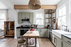 Good Bones "Historic Cottage for Flippers" kitchen with sage cabinets and black countertops