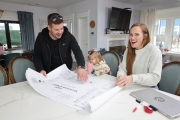 Corey and Mina go over the blueprints to upcoming projects. Renovated by Mina & Karen; as seen on Good Bones Season 7