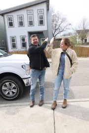 Cory and Mina high fiving outside. Renovated by Mina & Karen; as seen on Good Bones Season 7