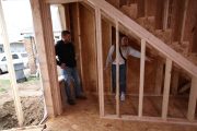 Mina and Cory inspecting the framing progress. Renovated by Mina & Karen; as seen on Good Bones Season 7