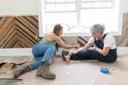 As seen on HGTV’s Good Bones, hosts Mina and Karen work on a feature wall in the front hallway of the home.