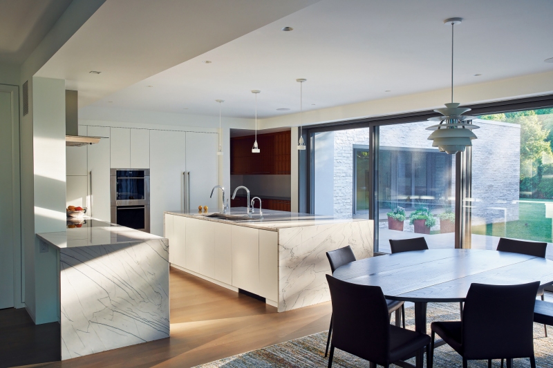 The kitchen island countertop, made from one solid piece of quartzite, weighs thousands of pounds and required the floor to be reinforced.