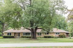 The ranch home sits on a peaceful, tree-lined court.