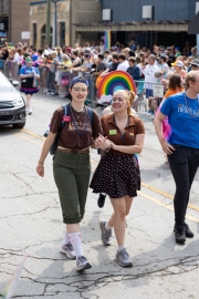 Photos from Indy Pride Parade 2022 a couple holds hands