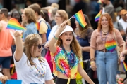 Photos from Indy Pride Parade 2022 people waving a flag