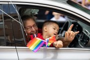 A kiddo waves a flag in the parade