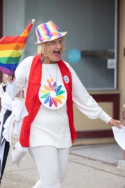 a woman walks in the parade