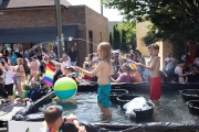 kids shoot water to a crowd