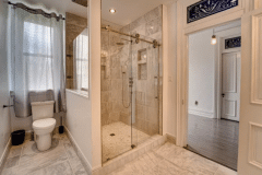 A bathroom with a large shower