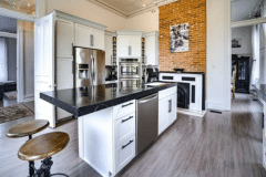 A modernized kitchen with a fireplace