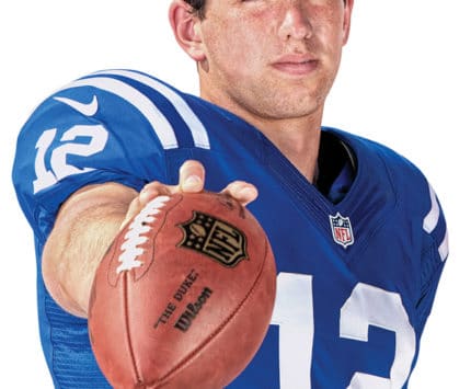 Andrew Luck with a football looking at camera