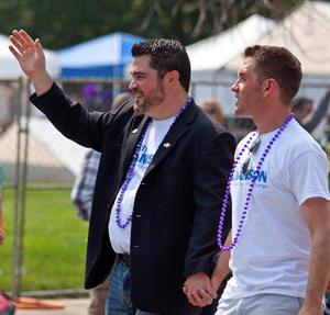 Zach Adamson and Christian Mosburg walk in the 2013 Indy Pride Festival Parade