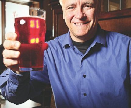 Jerry Rezny lifts a cherry-vanilla soda at Broad Ripple Brewpub.