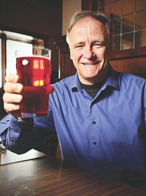 Jerry Rezny lifts a cherry-vanilla soda at Broad Ripple Brewpub.