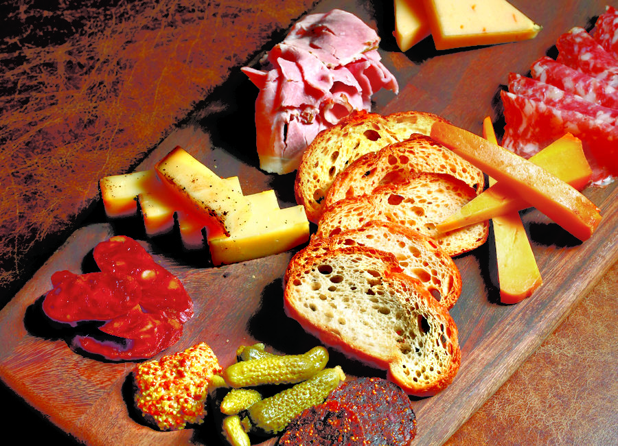 Charcuterie choices ranging from mortadella to vegan fig "salami"