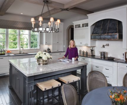 A custom-made zinc range hood carries on the home’s theme, as does the “zinc” kitchen table —actually an outdoor table from Restoration Hardware.