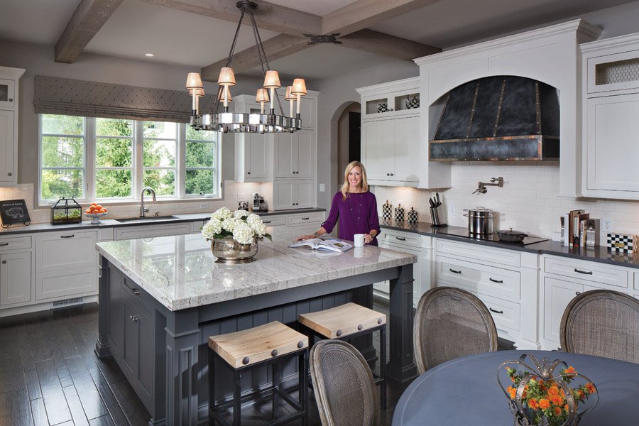 A custom-made zinc range hood carries on the home’s theme, as does the “zinc” kitchen table —actually an outdoor table from Restoration Hardware.