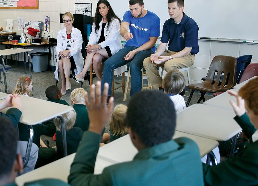 Andrew Luck and doctors from IU Health went back and forth with students from St. Richard