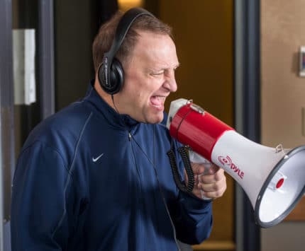 Dakich yelling into megaphone