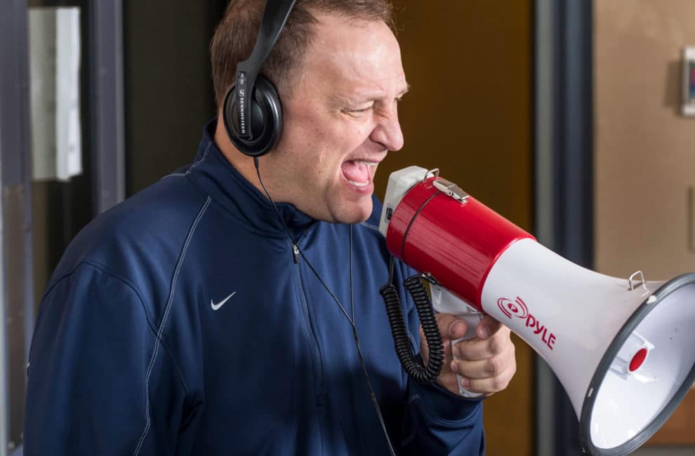 Dakich yelling into megaphone