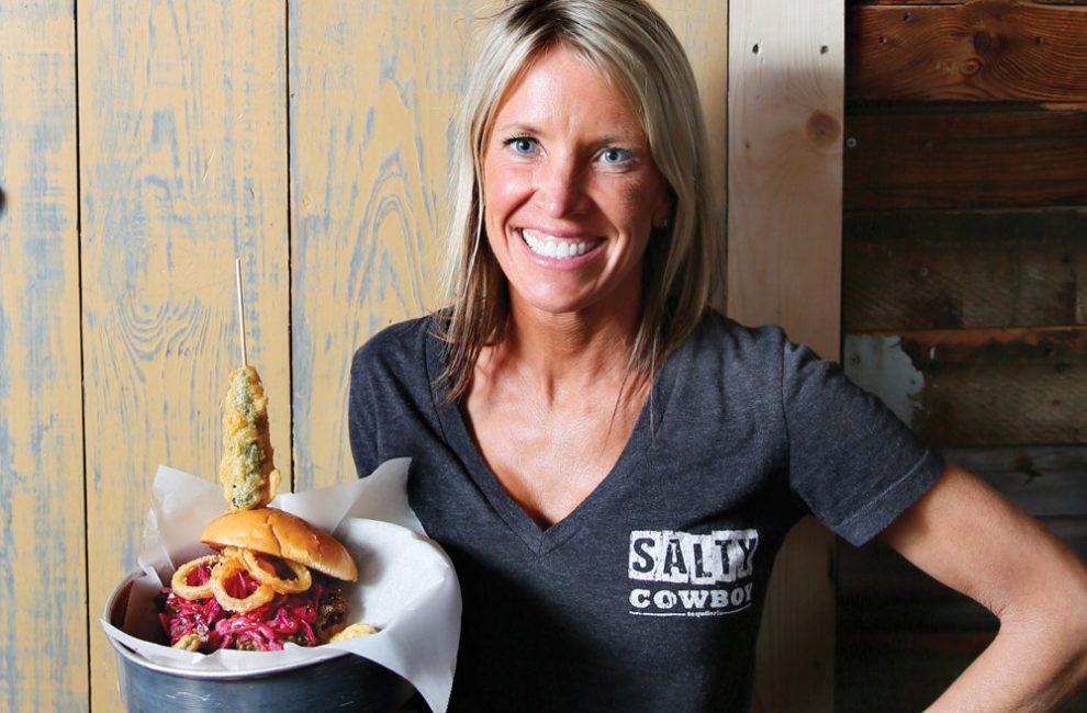 Owner Shari Jenkins with The Big Hughey burger.