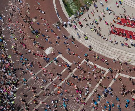 Hundreds gathered Tuesday, June 23, to do headstands on Monument Circle in as they attempt to set a world record for the most headstands performed at one time.