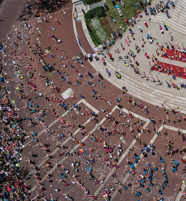 Hundreds gathered Tuesday, June 23, to do headstands on Monument Circle in as they attempt to set a world record for the most headstands performed at one time.