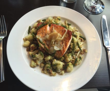 Salmon atop roasted cauliflower was served at Penn & Palate