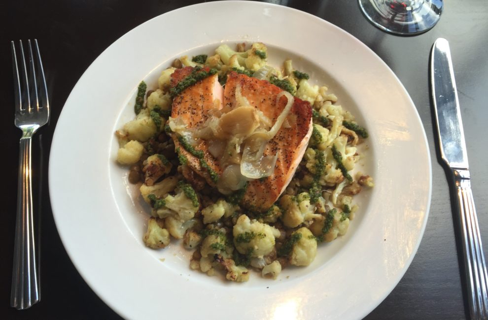 Salmon atop roasted cauliflower was served at Penn & Palate