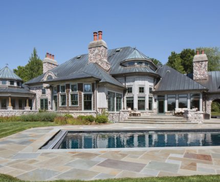 The original owners rinsed off their horses under the wide arch to the right of the house -- there