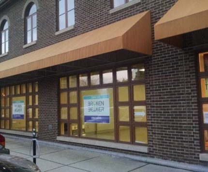 The exterior of Broken Beaker Distillery on Mass Ave.