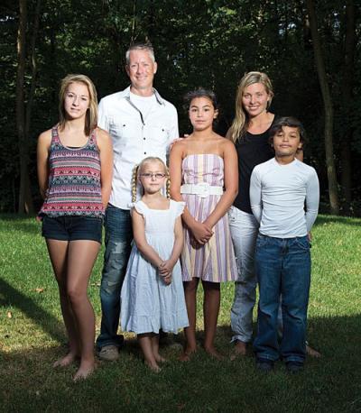 Shannon Raddin and Jade Walcott (right and center) with their family in Ohio.