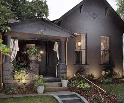 Cottage or bungalow style home painted black.