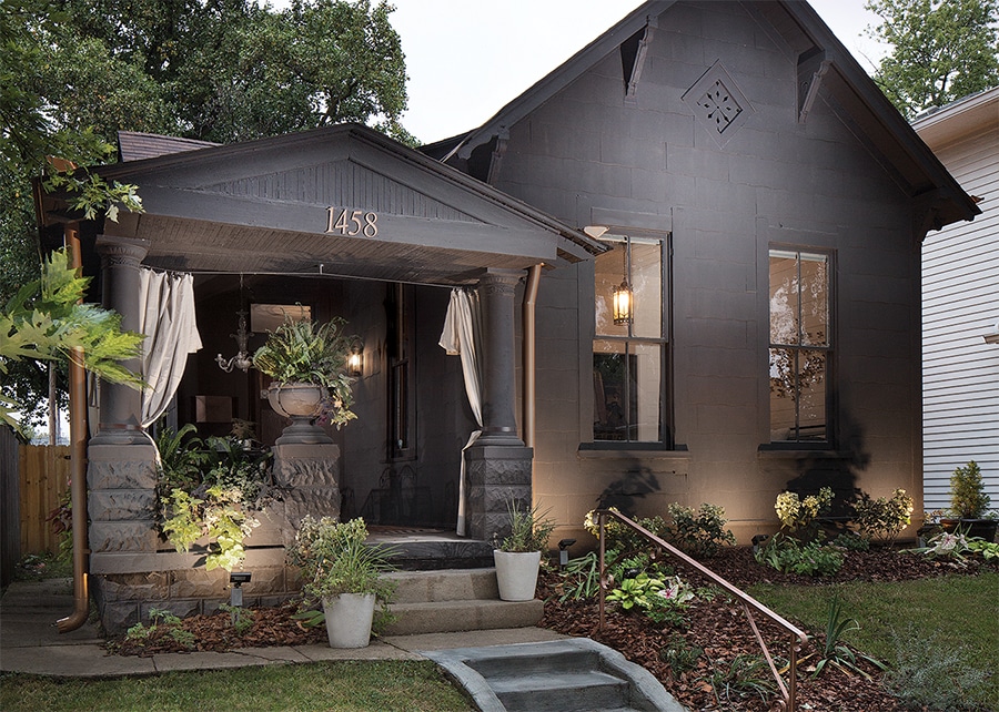 Cottage or bungalow style home painted black.