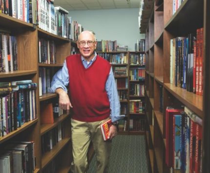 Mike Bursaw and rows of books