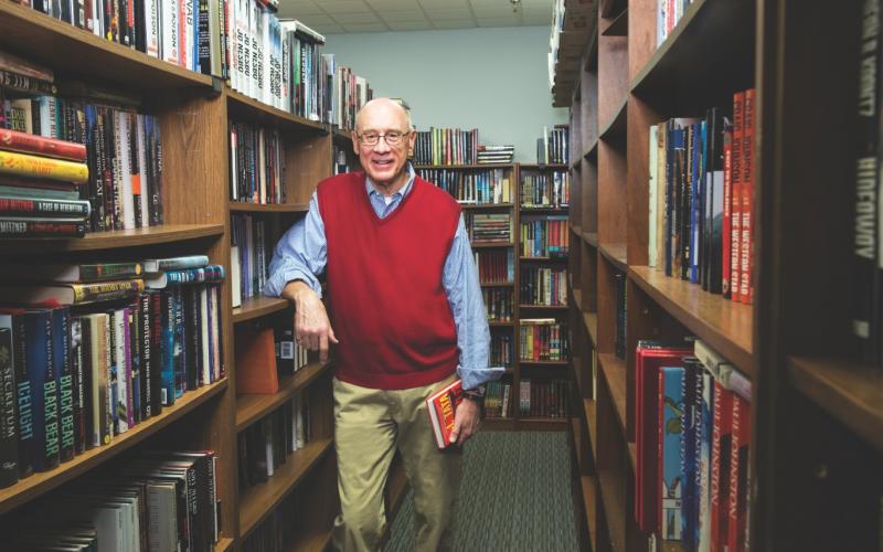 Mike Bursaw and rows of books