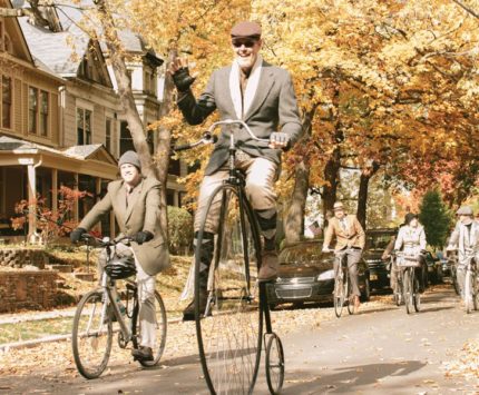 Bikers on old timey bikes at Tweed Ride