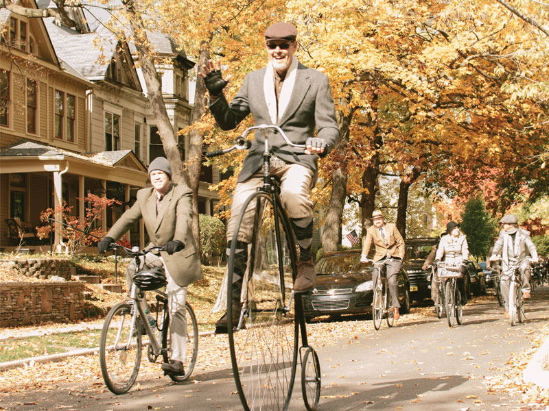 Bikers on old timey bikes at Tweed Ride