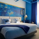 A hotel room adorned in blue hues