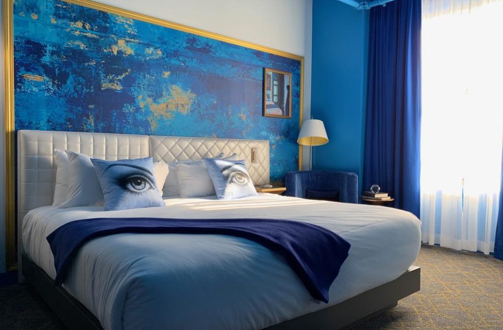 A hotel room adorned in blue hues