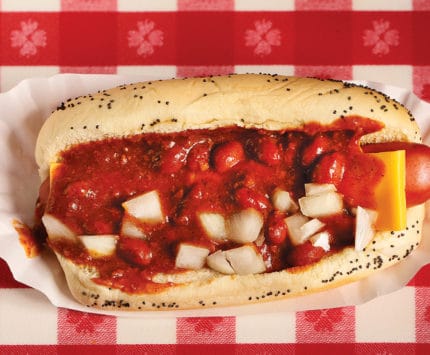 Portillos hot dog with beans, onions, and cheese
