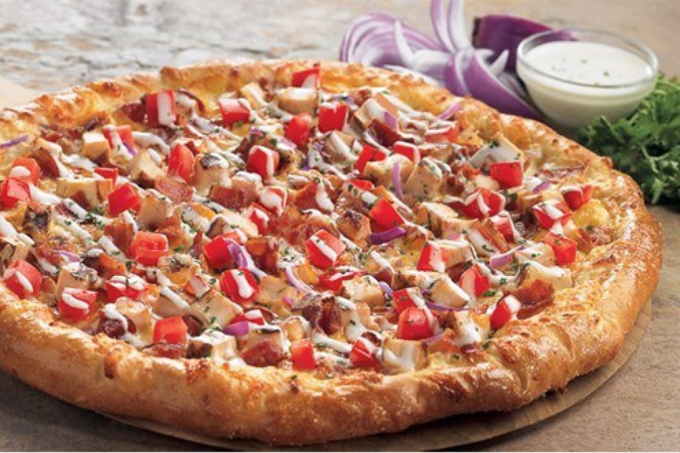 pizza with tomatoes, onion, and chicken from BJ's Restaurant